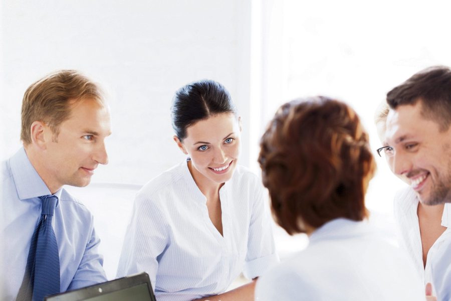 businesswoman with team on meeting in office
